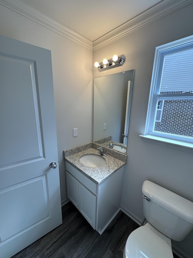 1476 Weeping Willow Ct, Ypsilanti, MI 48198 - half bath featuring toilet, vanity, crown molding, and wood finished floors