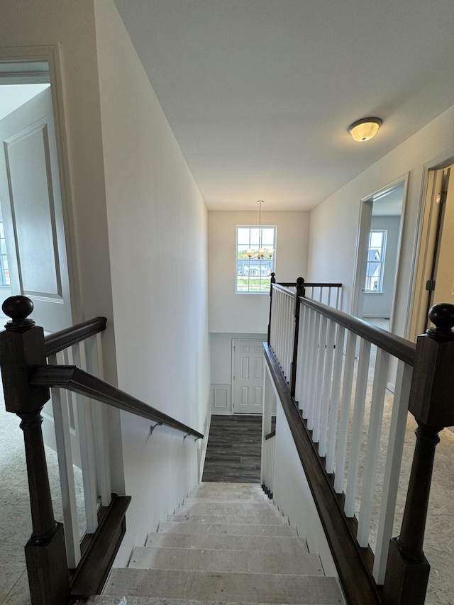 1476 Weeping Willow Ct, Ypsilanti, MI 48198 - stairway with a chandelier and wood finished floors