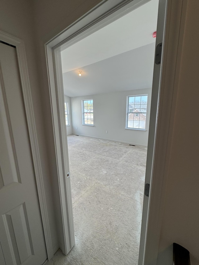 1476 Weeping Willow Ct, Ypsilanti, MI 48198 - unfurnished room featuring light colored carpet, plenty of natural light, and baseboards