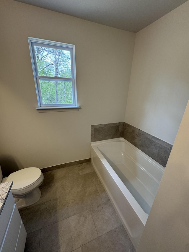 1476 Weeping Willow Ct, Ypsilanti, MI 48198 - bathroom with a bath, toilet, vanity, and baseboards