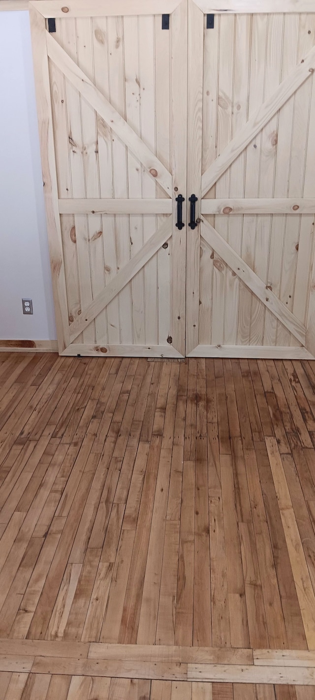 interior details featuring hardwood / wood-style flooring