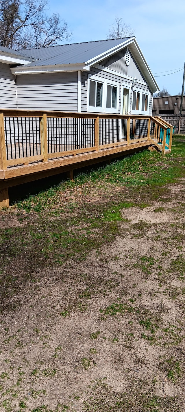 back of property with a wooden deck