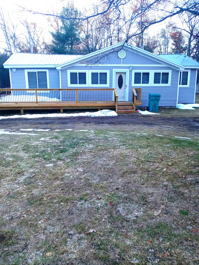 view of front of house with a wooden deck