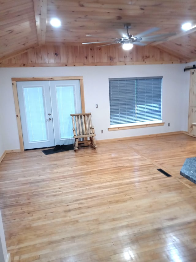 interior space featuring light wood-type flooring, wooden ceiling, ceiling fan, and lofted ceiling