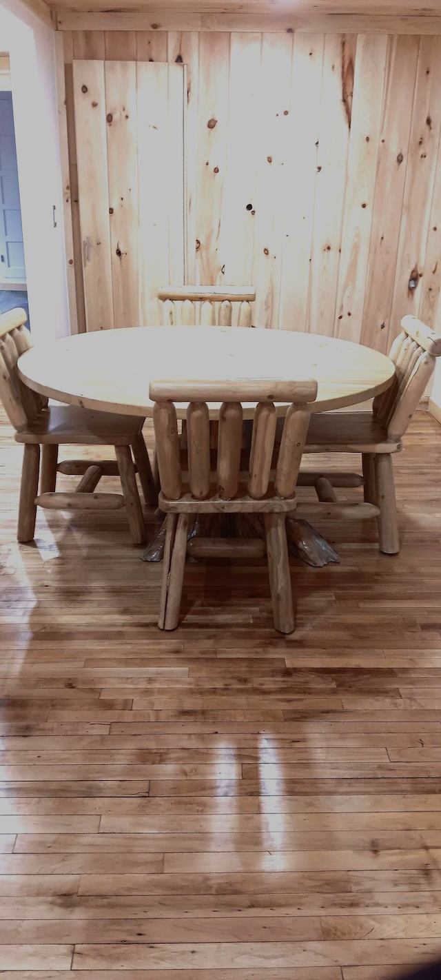 unfurnished dining area featuring hardwood / wood-style floors