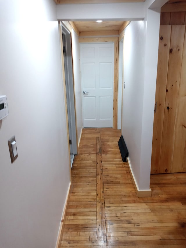 hall with light wood-type flooring