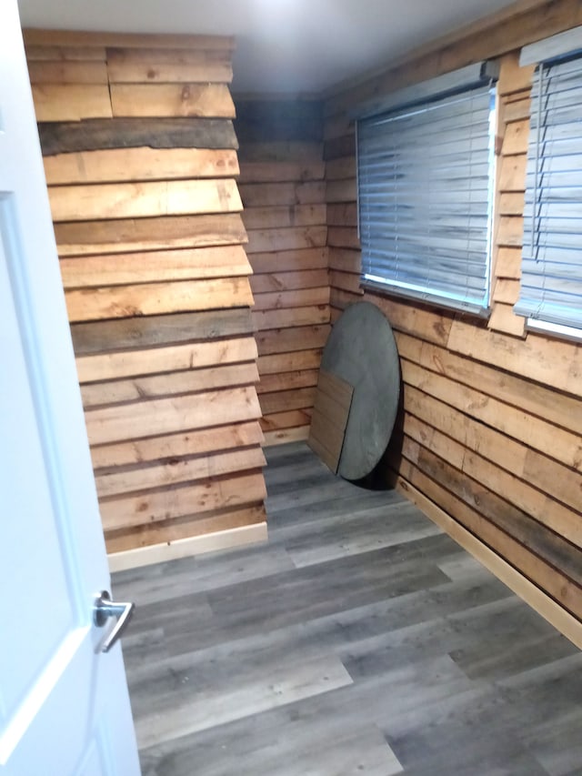 interior details with wood walls and wood-type flooring