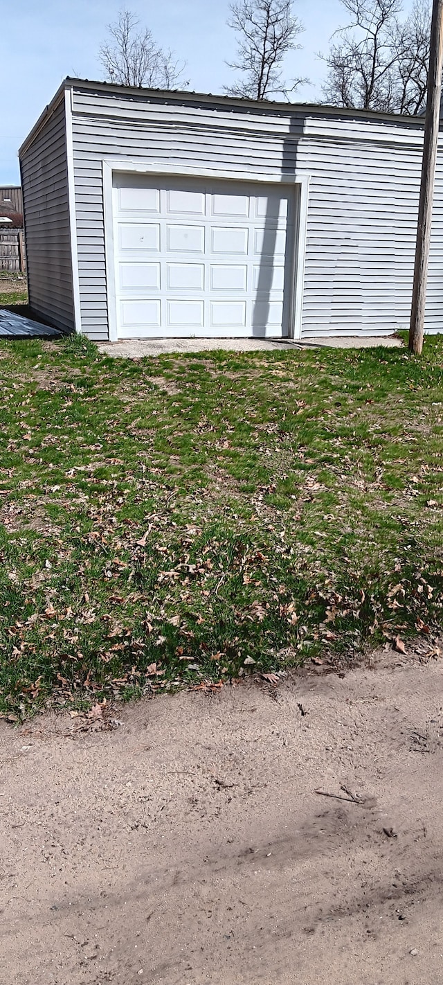 garage with a yard