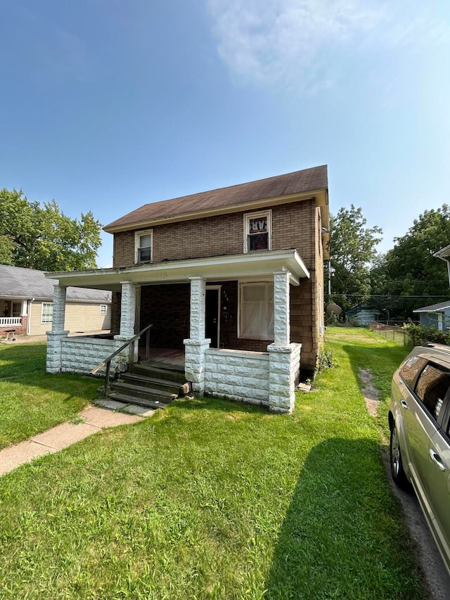 view of front of house with a porch and a front lawn