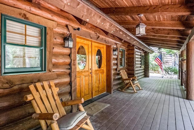 doorway to property featuring a porch