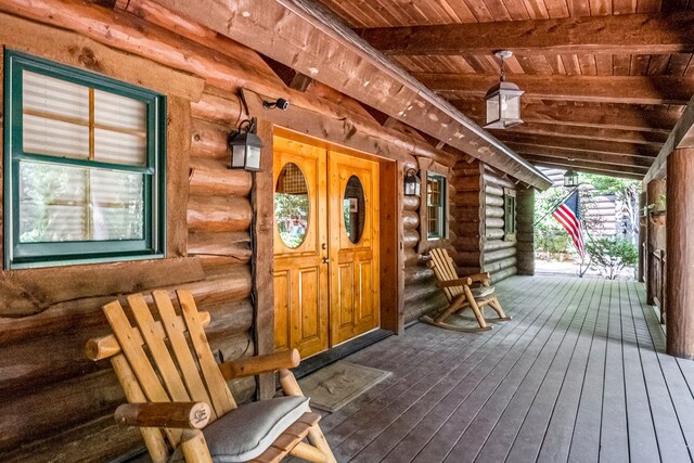 11245 Guyn Dr, Brighton, MI 48114 - view of exterior entry with a porch