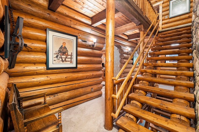 11245 Guyn Dr, Brighton, MI 48114 - staircase with carpet floors and wood ceiling with exposed beams