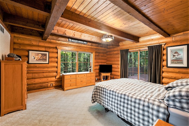 carpeted bedroom with beamed ceiling, access to outside, rustic walls, and multiple windows