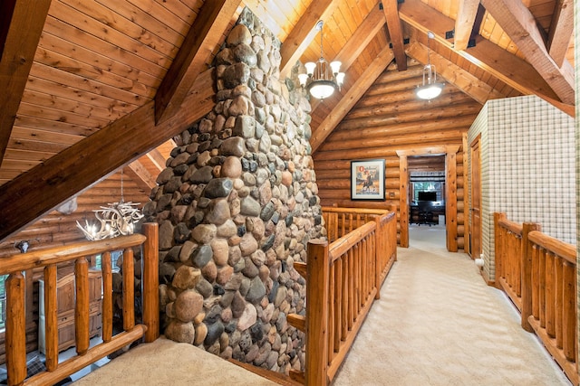 corridor with light carpet, rustic walls, wood ceiling, a chandelier, and vaulted ceiling with beams