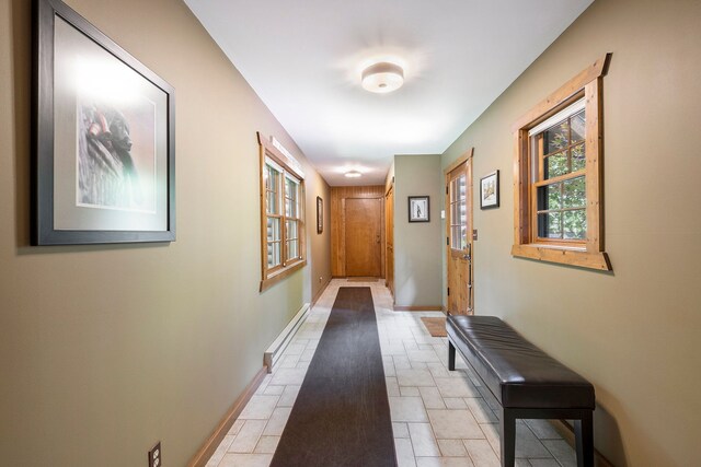 11245 Guyn Dr, Brighton, MI 48114 - hallway featuring baseboards and light stone finish floors