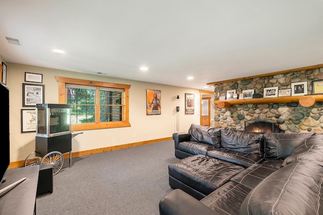 living room featuring carpet flooring and a fireplace