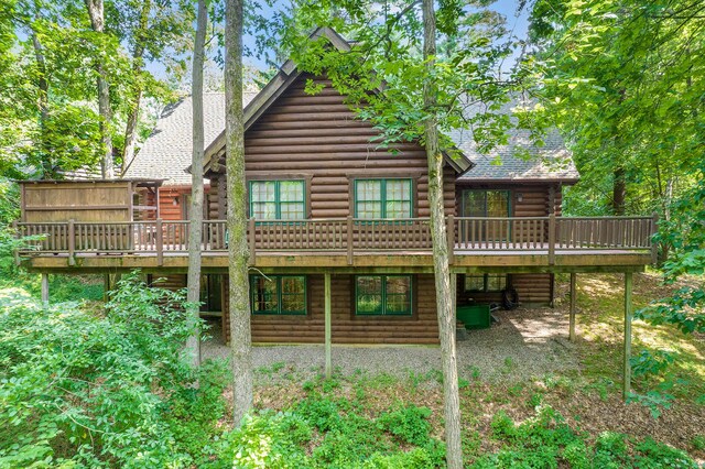 rear view of house featuring a deck