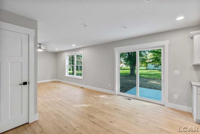 unfurnished room with light hardwood / wood-style flooring and ceiling fan