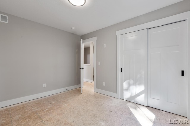 unfurnished bedroom featuring a closet