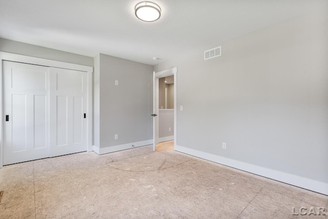 unfurnished bedroom featuring a closet