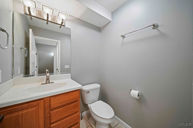 bathroom with tile patterned floors, vanity, and toilet