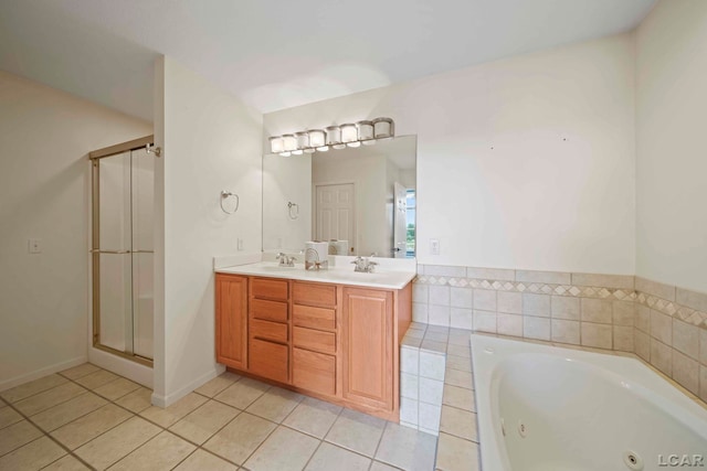 bathroom with tile patterned flooring, vanity, and independent shower and bath