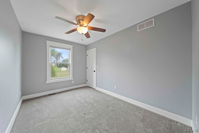 carpeted empty room with ceiling fan