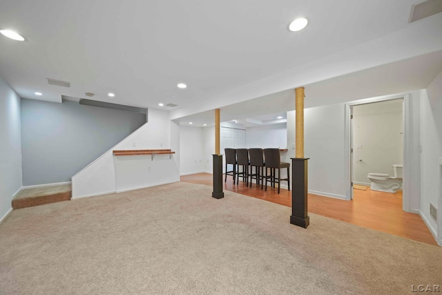 basement with light colored carpet