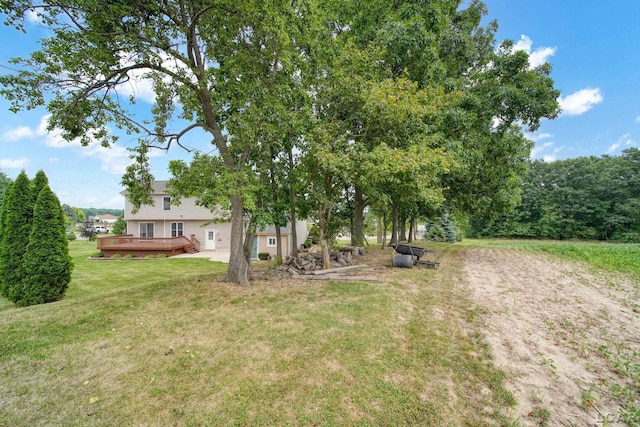 view of yard with a wooden deck