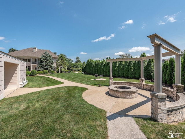 view of yard with a fire pit and a patio