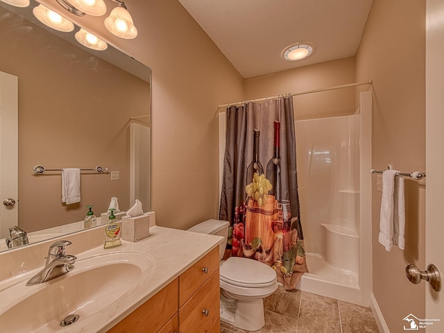 bathroom featuring tile patterned flooring, vanity, curtained shower, and toilet