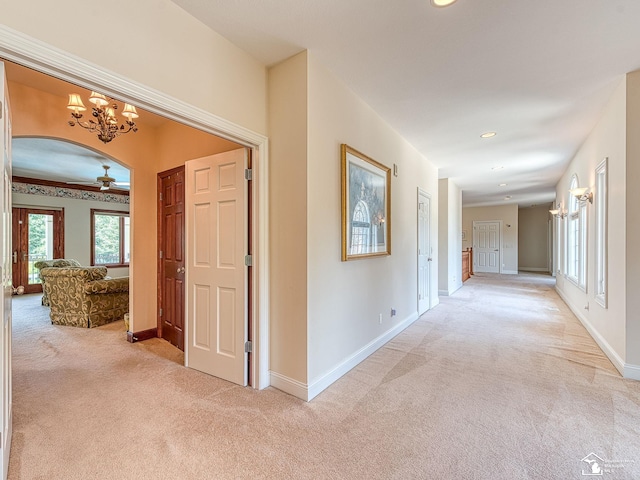 corridor with light colored carpet