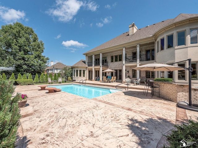 view of swimming pool with a patio area