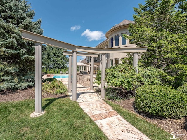 exterior space featuring a lawn and a swimming pool