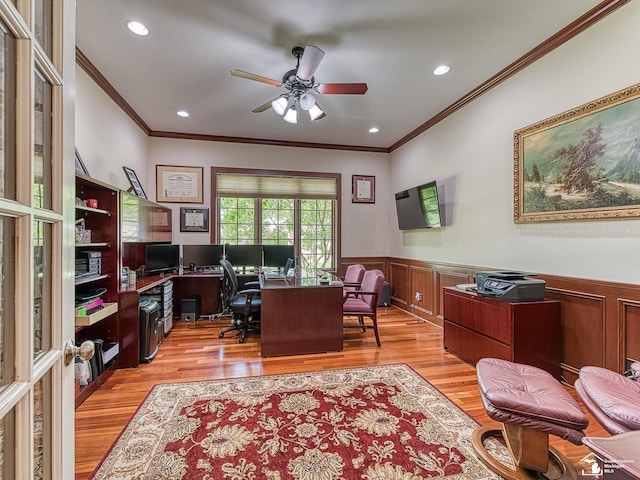 office featuring ceiling fan, ornamental molding, and light hardwood / wood-style flooring