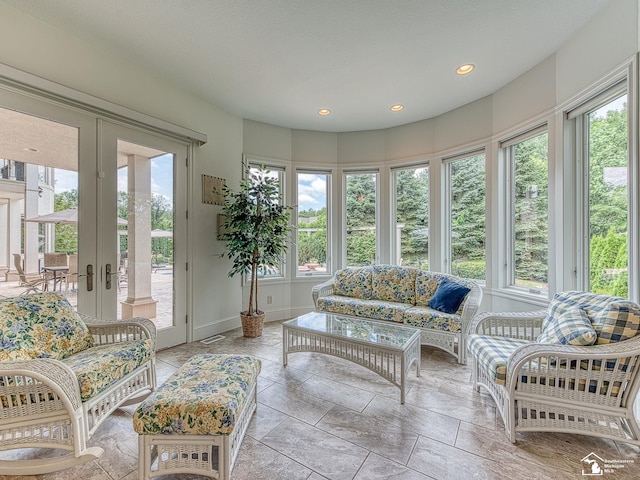 sunroom / solarium with a wealth of natural light and french doors