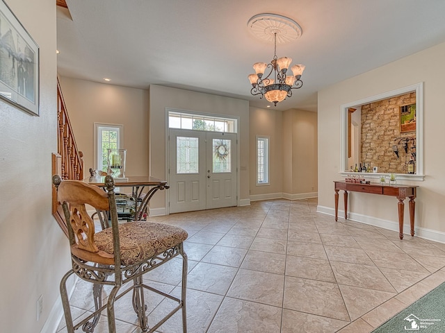 entryway featuring light tile patterned floors and an inviting chandelier