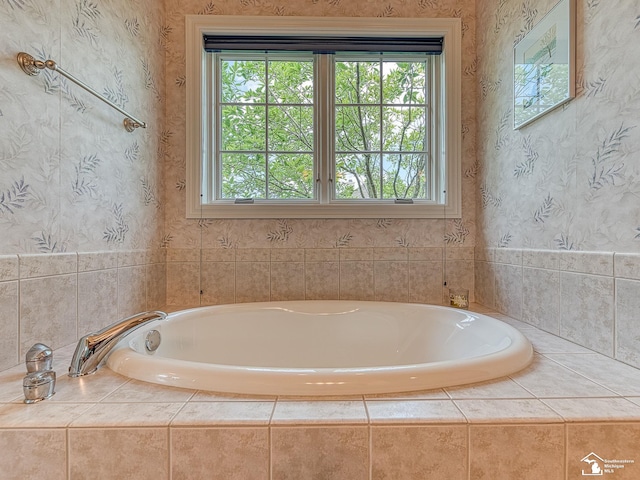 bathroom featuring tiled tub