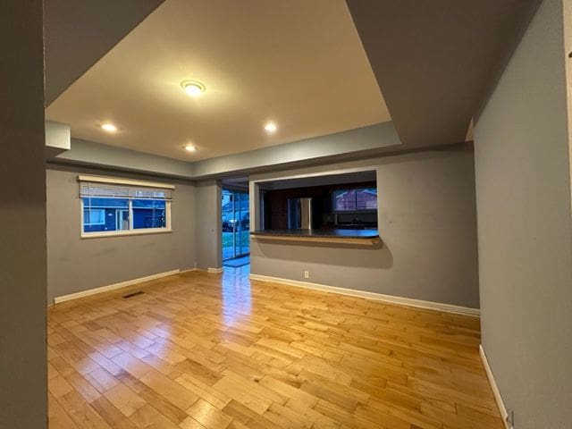 spare room featuring light wood-type flooring