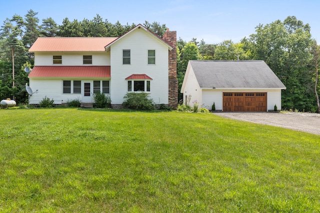 view of front of property with a garage and a front yard