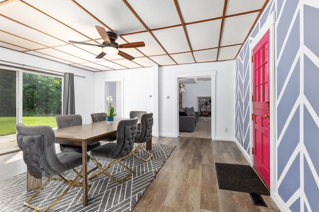 dining room with ceiling fan and hardwood / wood-style floors