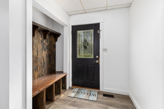 mudroom with a paneled ceiling and hardwood / wood-style flooring