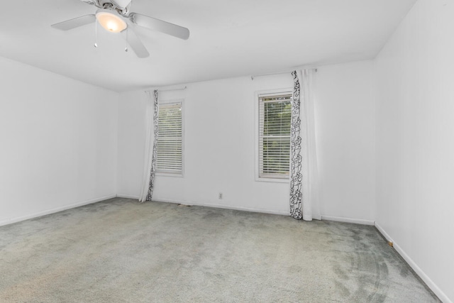 carpeted empty room with ceiling fan