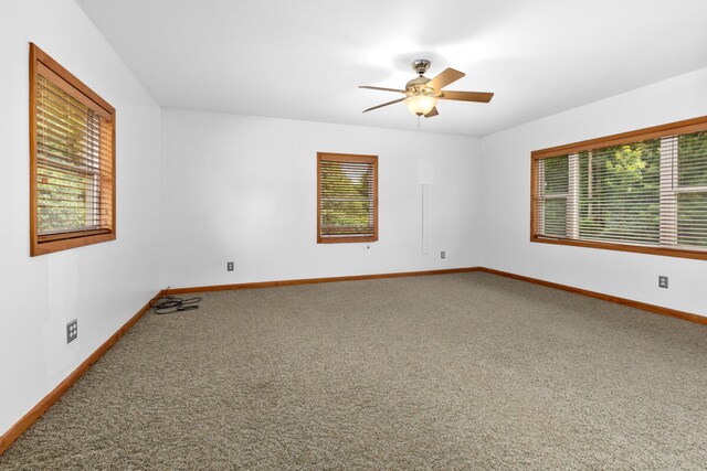 carpeted empty room with ceiling fan