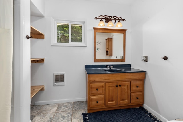 bathroom with vanity and heating unit