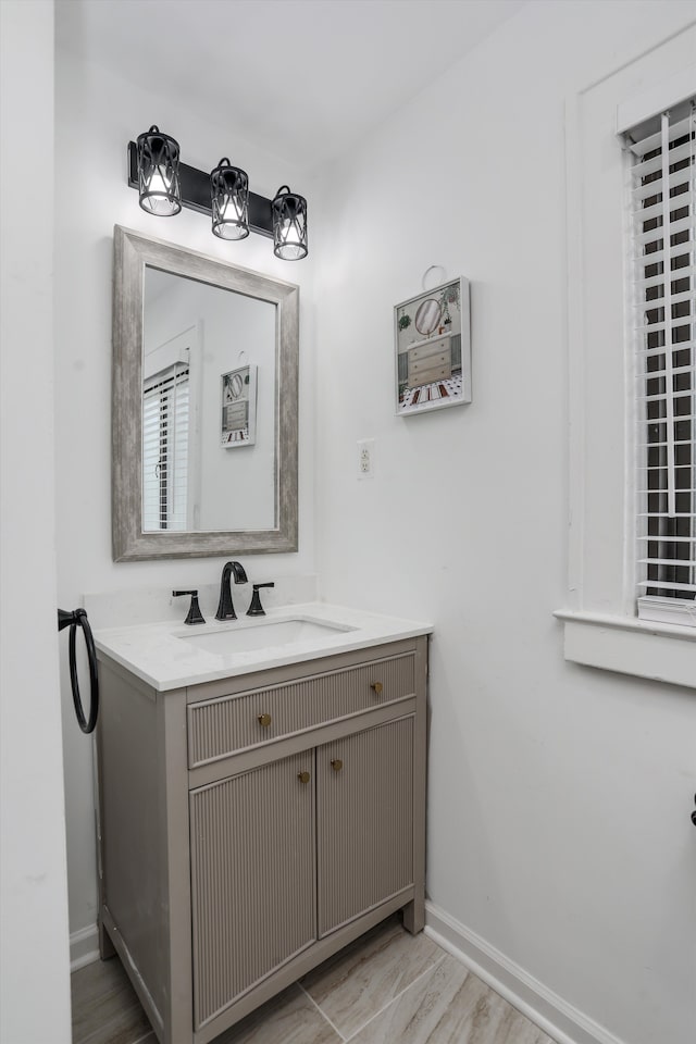 bathroom featuring vanity and hardwood / wood-style flooring