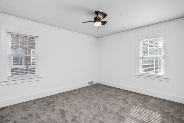 unfurnished room featuring carpet flooring, ceiling fan, and ornamental molding