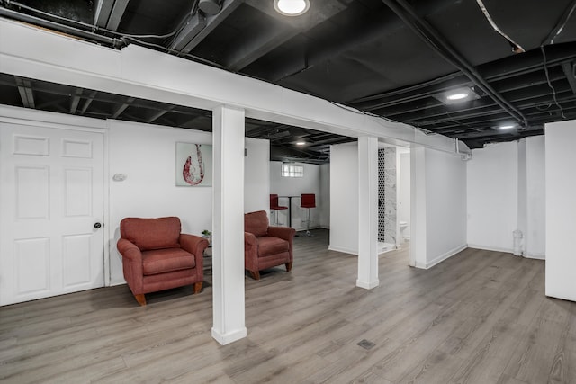 basement featuring light wood-type flooring