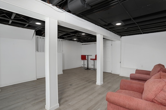 basement featuring wood-type flooring