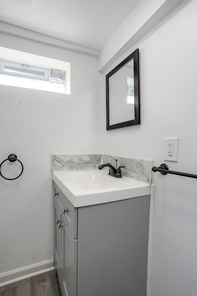 bathroom featuring hardwood / wood-style floors and vanity